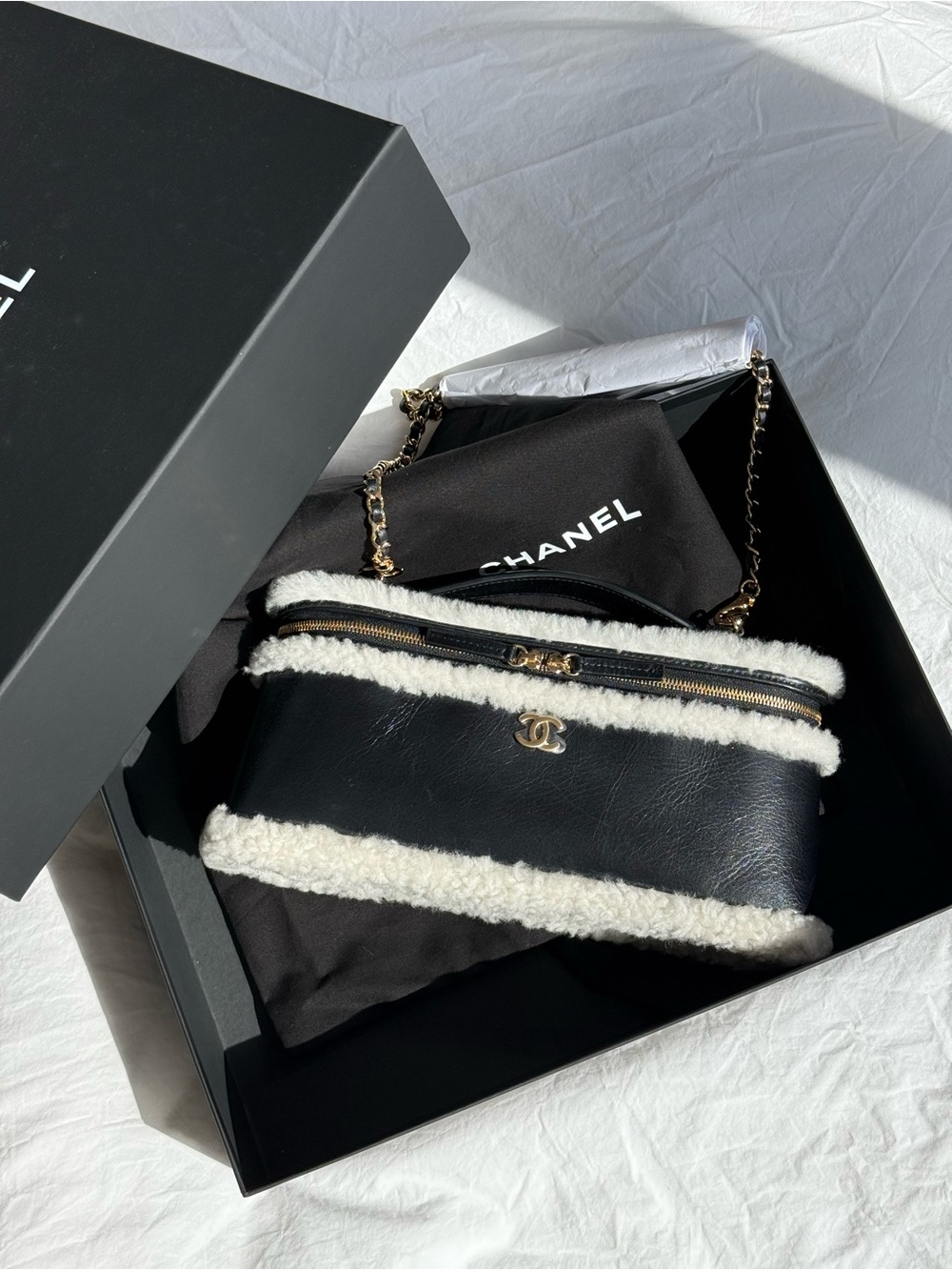 CHANEL Black Leather Shoulder Bag with White Shearling Trim